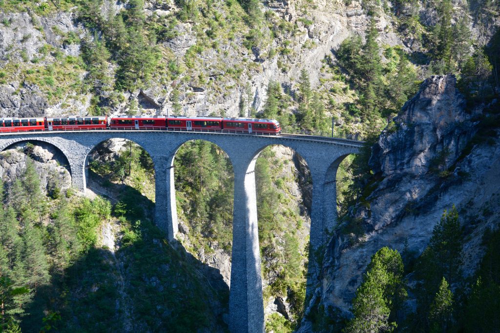 Bernina Express, Via Albula, Switzerland, train, travel by train, mountains, narrow rails, treinreis, Graubünden, rode trein, Zwitserse Alpen